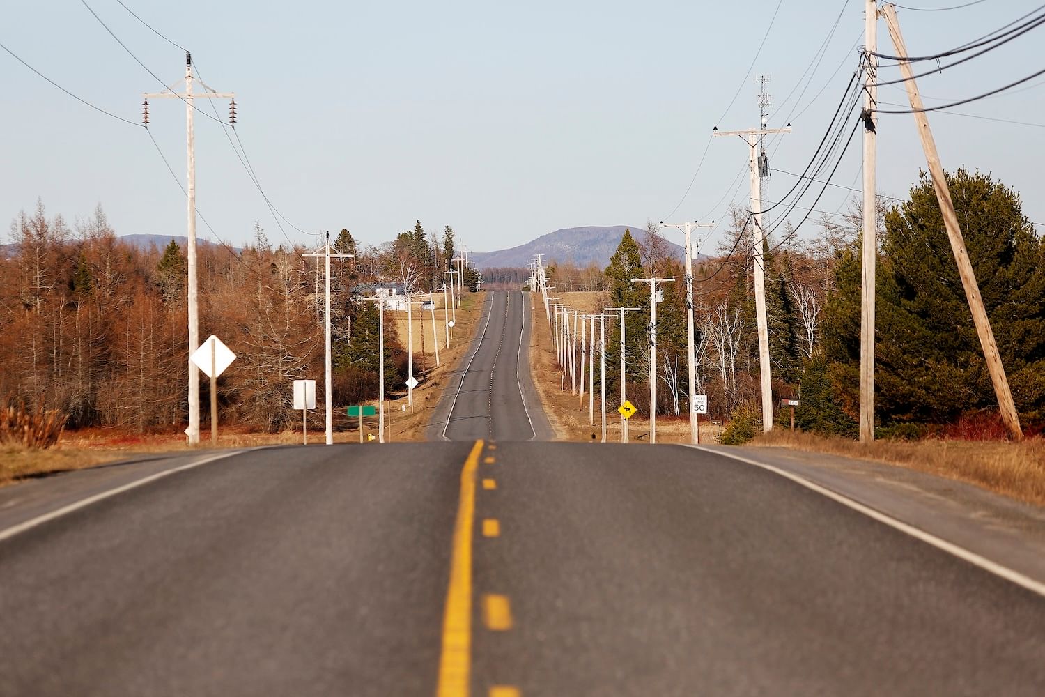 Two-lane road with wires on either side