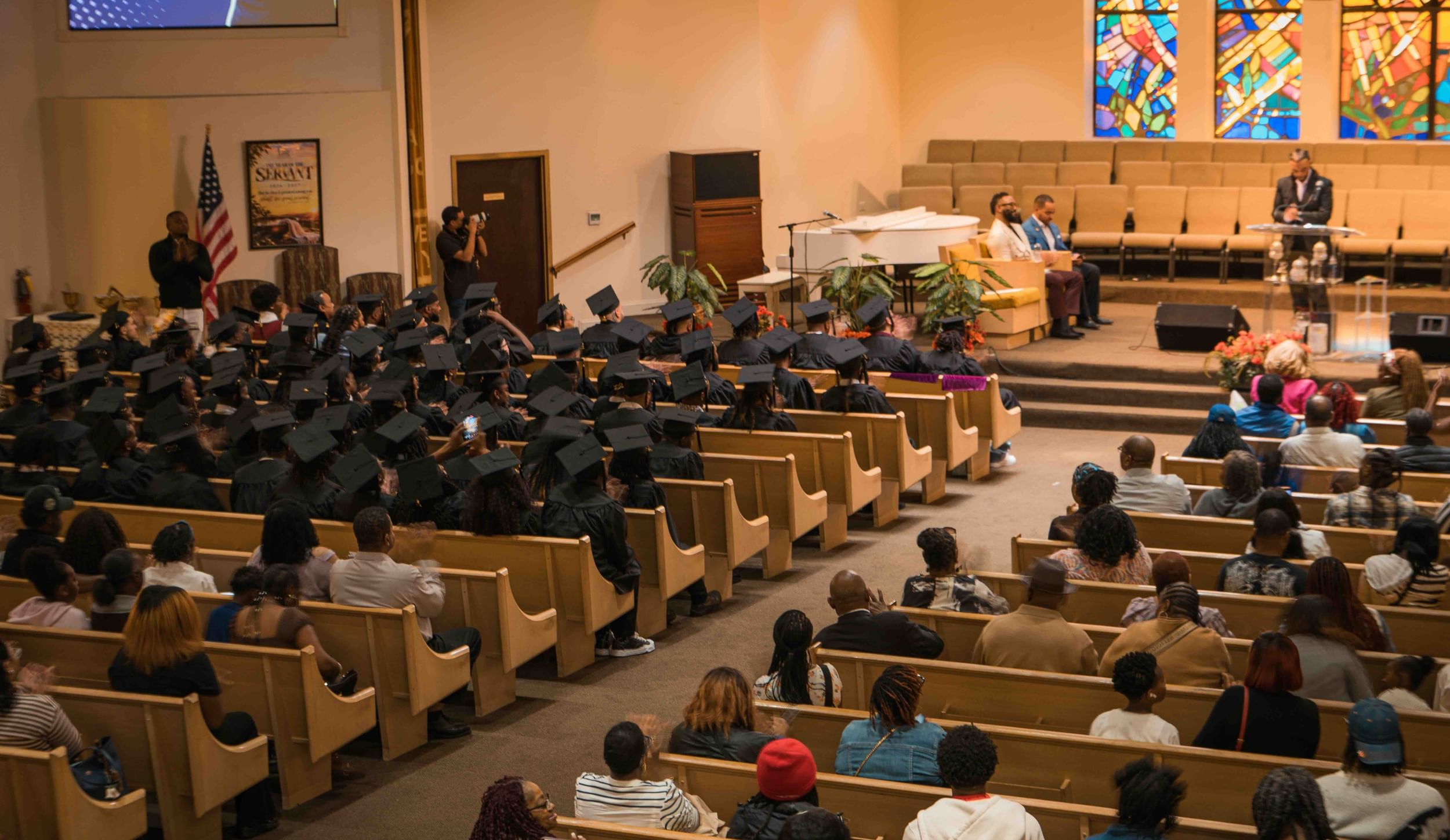 church scene with graduates and others