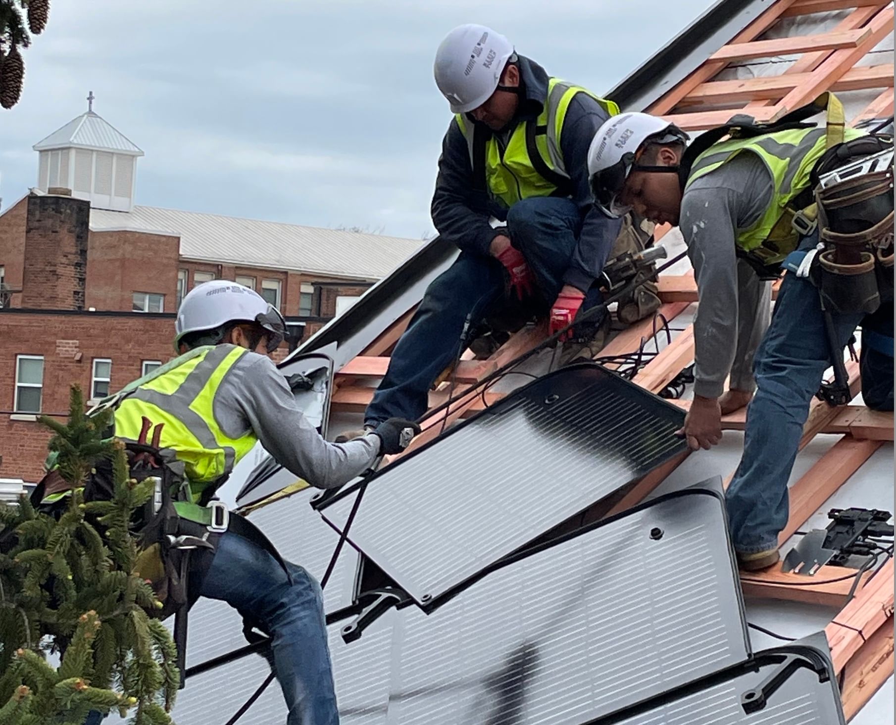 Solar installers on a rooftop in Washington DC