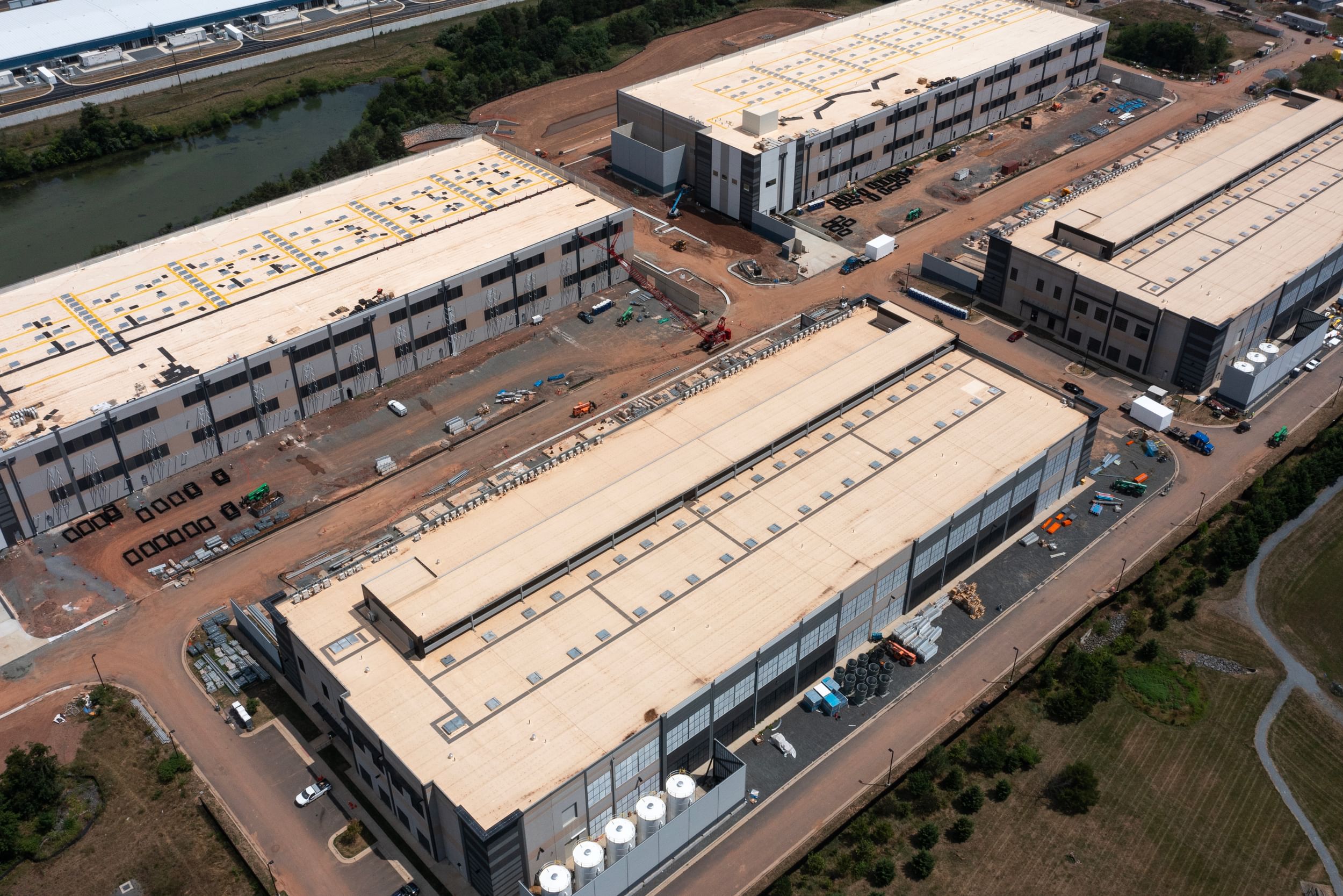 A cluster of four large data centers seen from above