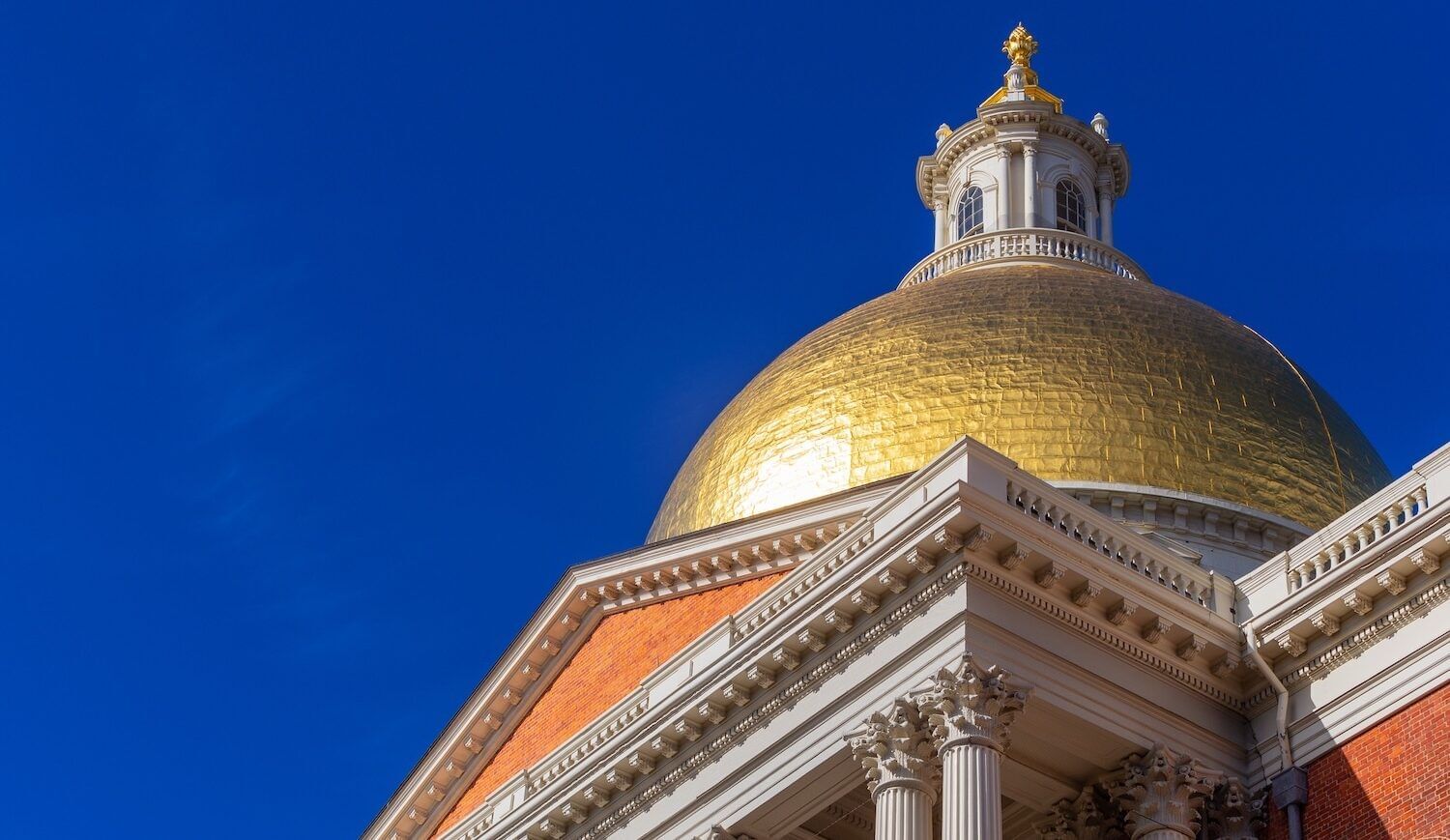 Gold-domed building against a cloudless blue sky