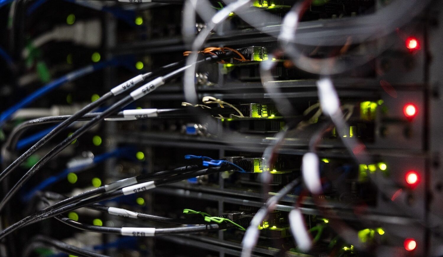 Close up of wires plugged into computing equipment