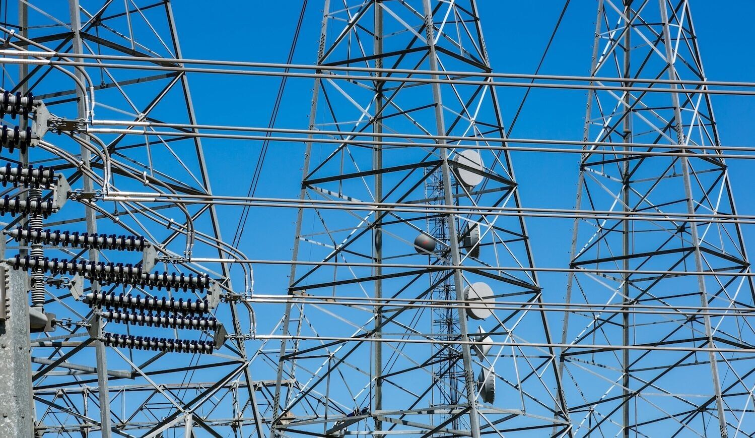 Transmission lines and communications equipment with blue-sky background