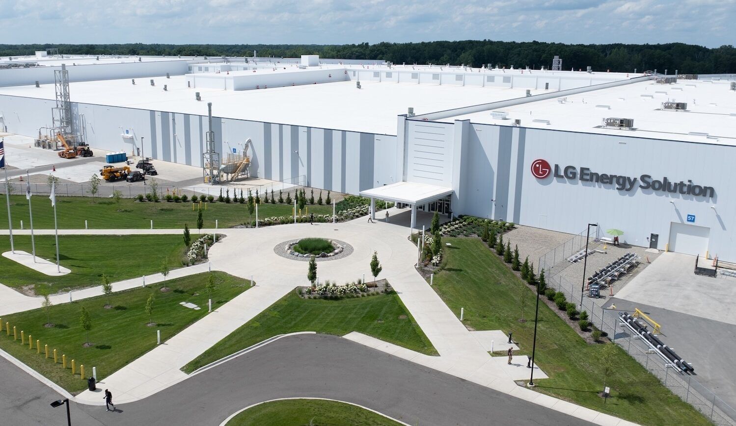 Large white production plant with red logo and sign saying LG Energy Solution