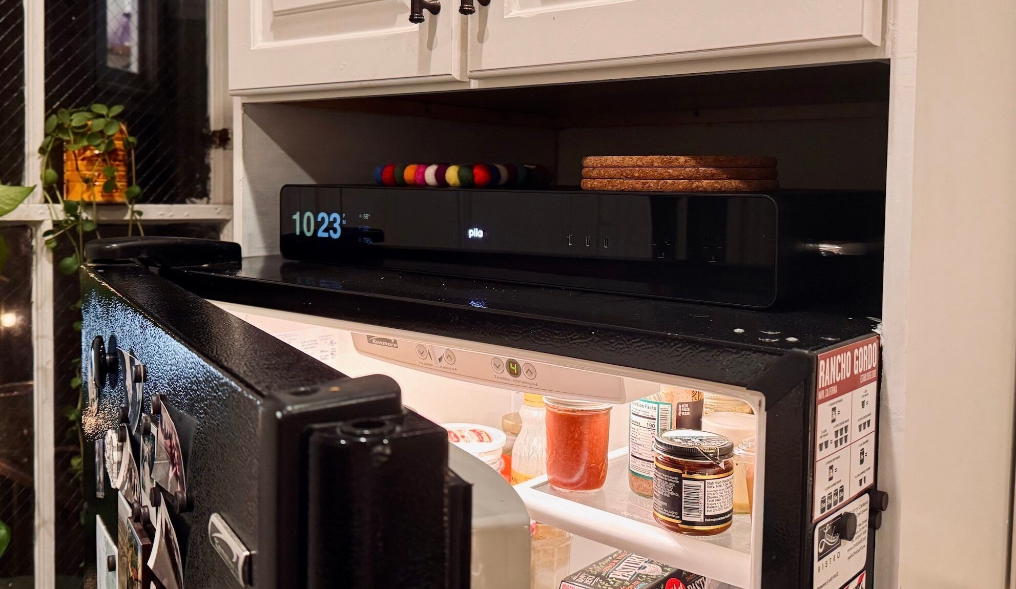 A Pila Mesh Home Battery atop a refrigerator in a home of one of Pila Energy’s friends-and-family testers