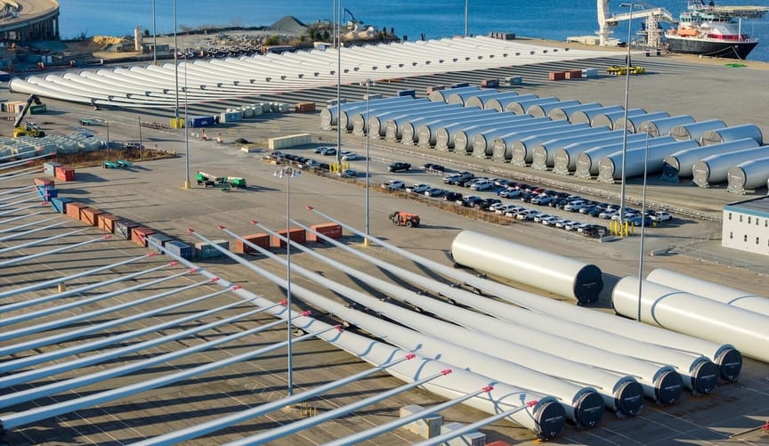 Aerial view of wind turbine equipment on a large lot
