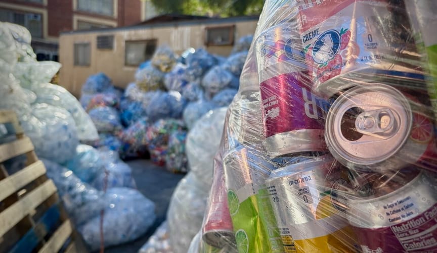 Close up of cans in a clear bag, with lots of other bags stacked in the background