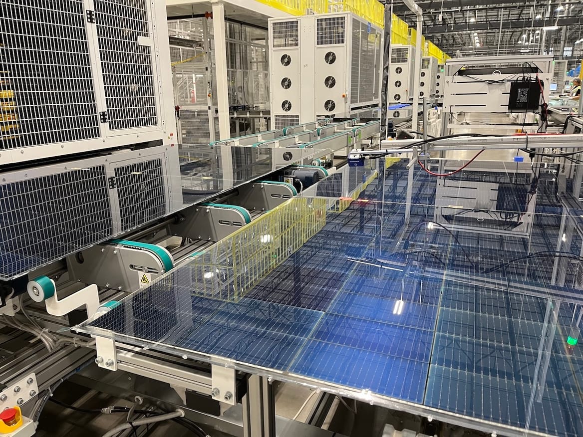 Solar cells on a production line in a large warehouse
