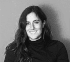 A smiling woman with long dark hair