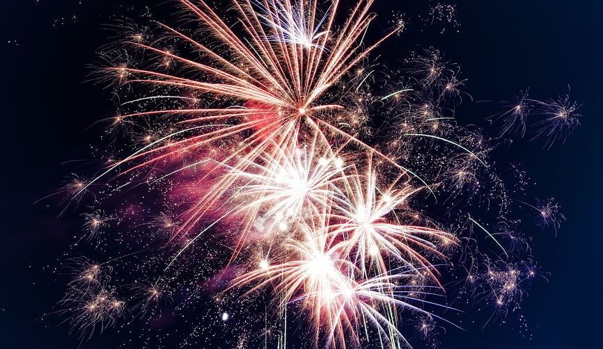 a huge fireworks display in a dark nighttime sky