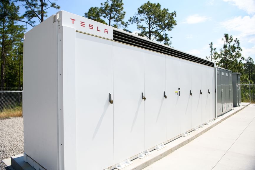 A row of white rectangular metal boxes