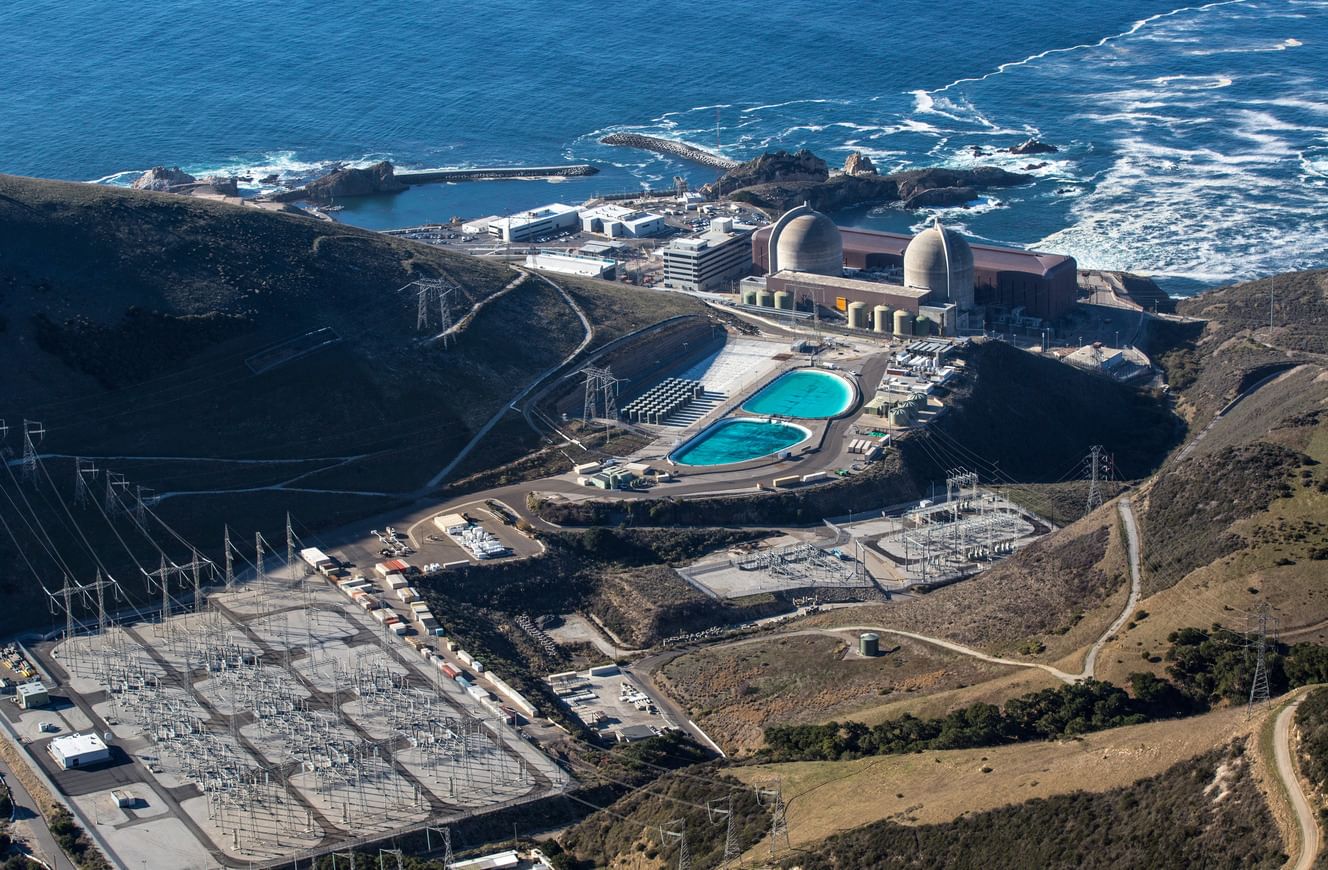 An aerial view of a nuclear power plant near the ocean